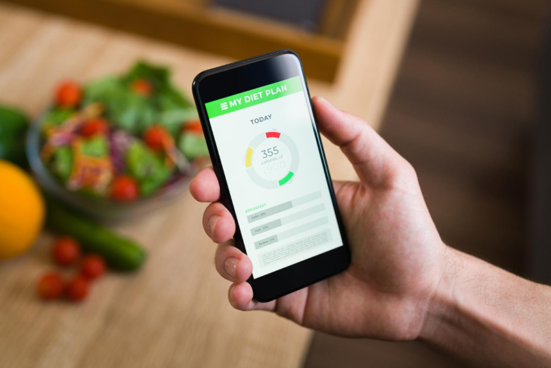 healthy diet male keeping track calories his food with fitness app